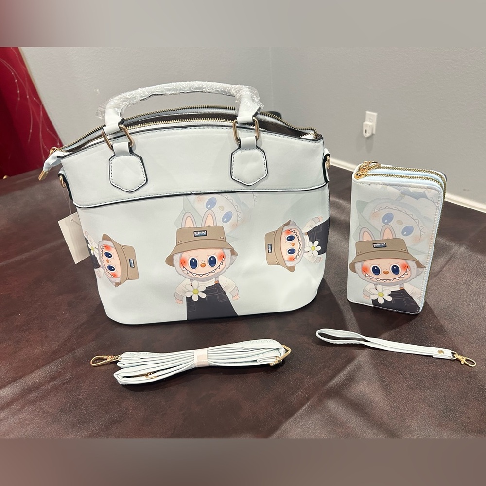 The Monsters Fall in Wild (Monster) Light Blue Handbag and matching Wallet set.
